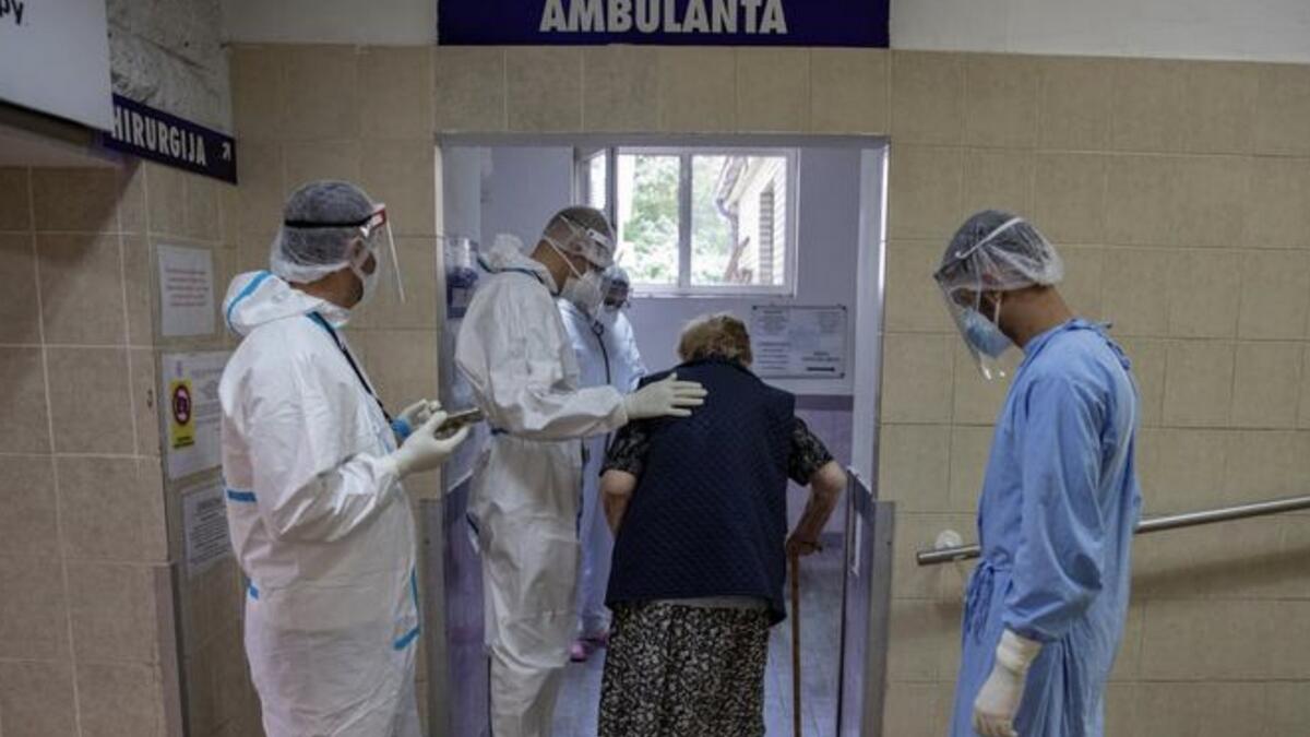 Medical workers attend to a patient suffering from the coronavirus at University Hospital Medical Center Bezanijska kosa in Belgrade, Serbia.