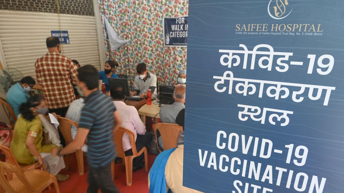 People waiting to get their coronavirus vaccine at a Mumbai hospital. Photo: AFP