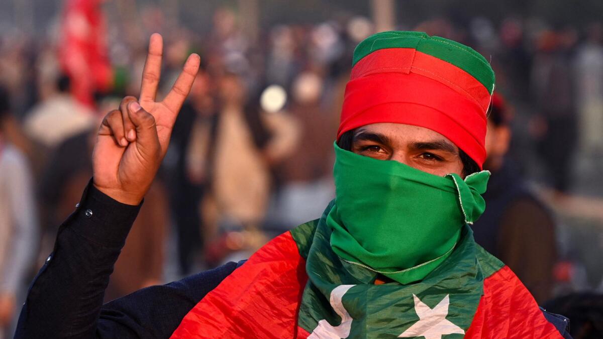 Supporters of Imran Khan's Pakistan Tehreek-e-Insaf (PTI) party block Peshawar to Islambad highway as they protest against the alleged skewing in Pakistan's national election results, in Peshawar. — AFP