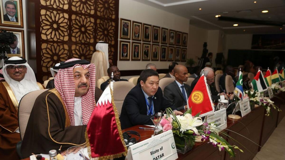 Qatari Foreign Minister Khalid bin Mohamed Al Attiyah (L) attends a meeting of the Organisation of Islamic Cooperation (OIC) in the Saudi city of Jeddah. 
