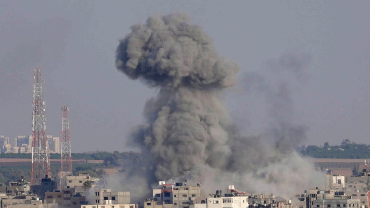 Smoke rises after Israeli airstrikes on a residential building in Gaza. — AP