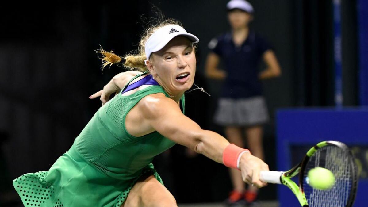 Wozniacki sets up Osaka final after Radwanska win
