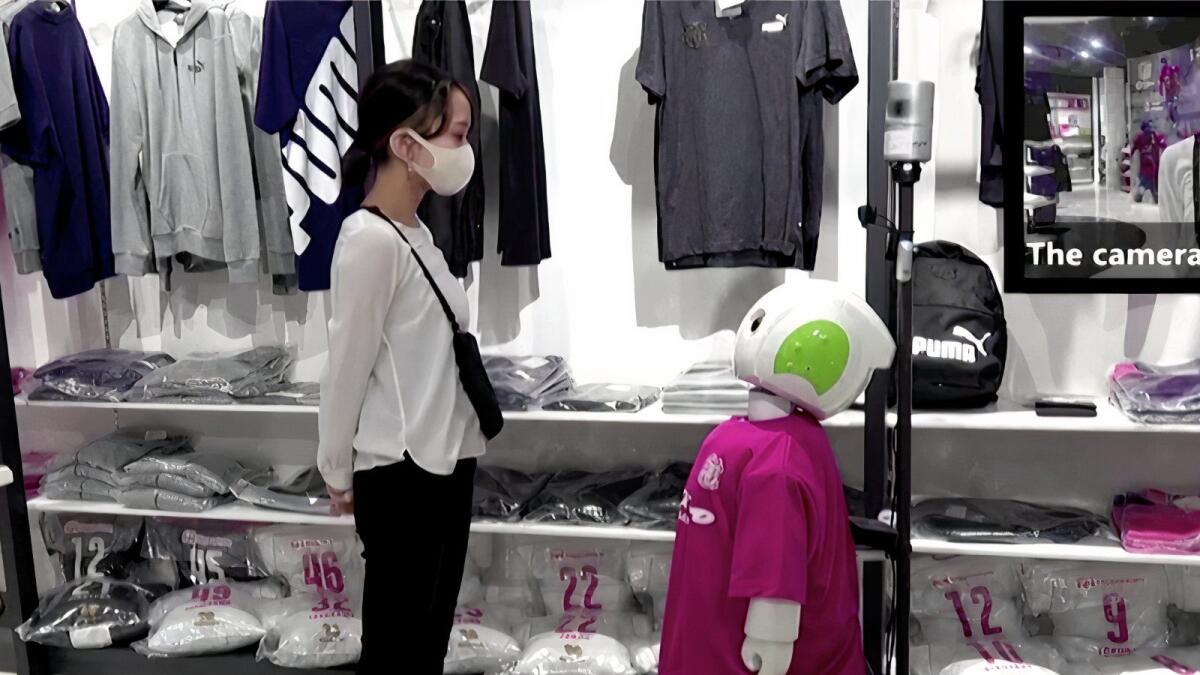 The robot nicknamed 'Robovie' has been deployed at a sports store in the city of Osaka in an experiment by Kyoto-based research institute ATR.