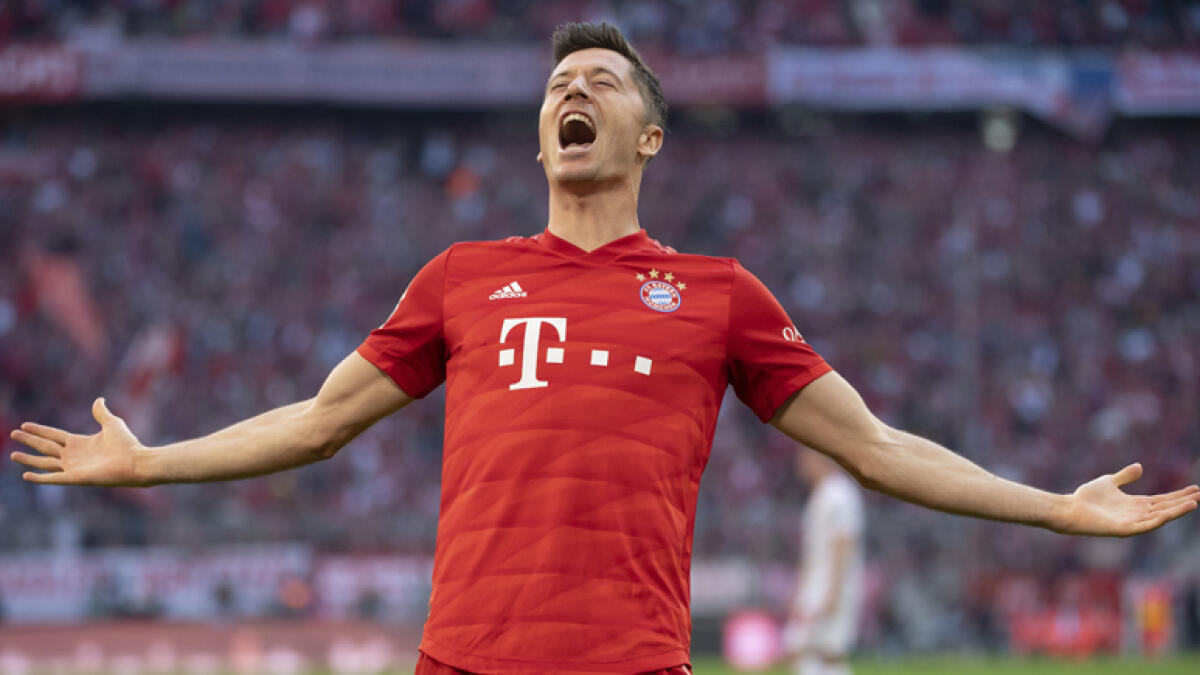 Lewandowski makes history again as Bayern reclaim summit
