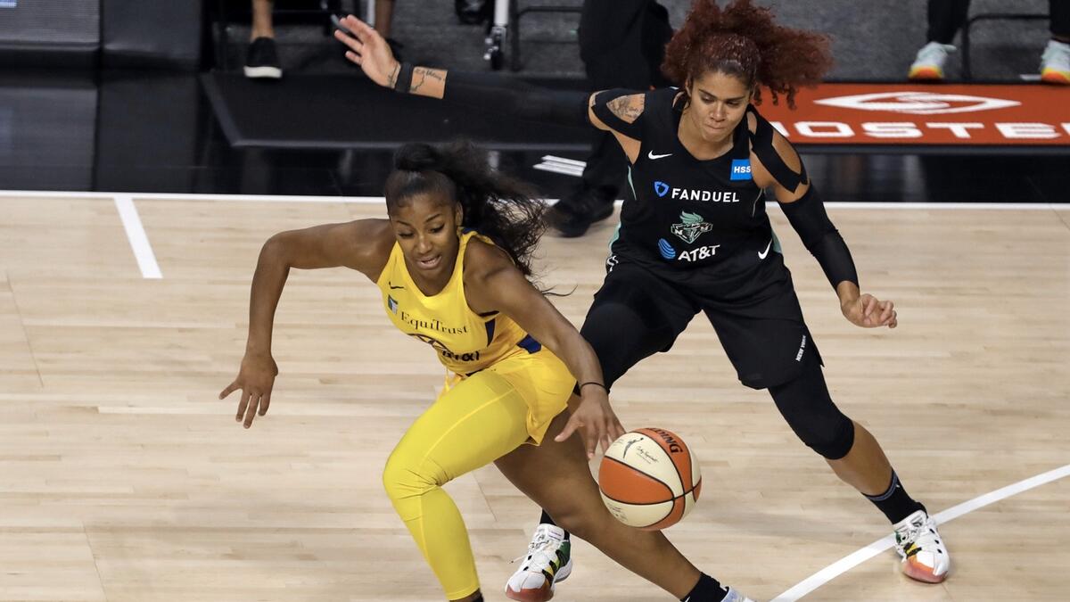 Los Angeles Sparks guard Te'a Cooper (4) steals the ball from New York Liberty center Amanda Zahui B. (17) during the first half of a WNBA basketball game, in Bradenton, Fla. Photo: AP