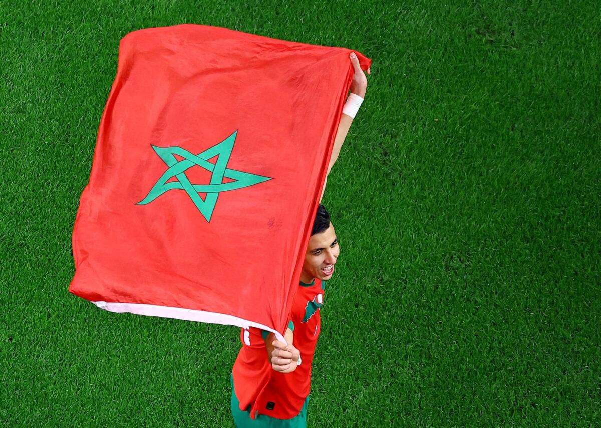 Morocco's Jawad El Yamiq celebrates after the match as Morocco qualify for the quarter finals. Photo: Reuters