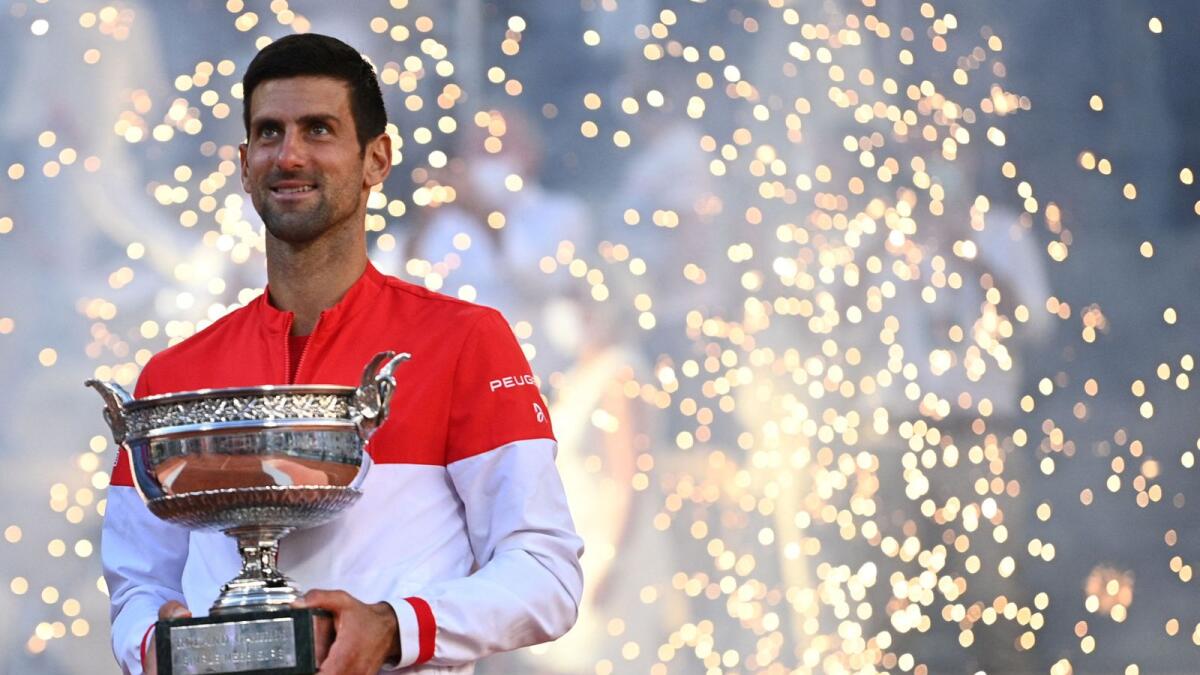 Serbia's Novak Djokovic poses with The Mousquetaires Cup (The Musketeers) after winning the final against Greece's Stefanos Tsitsipas. — AFP