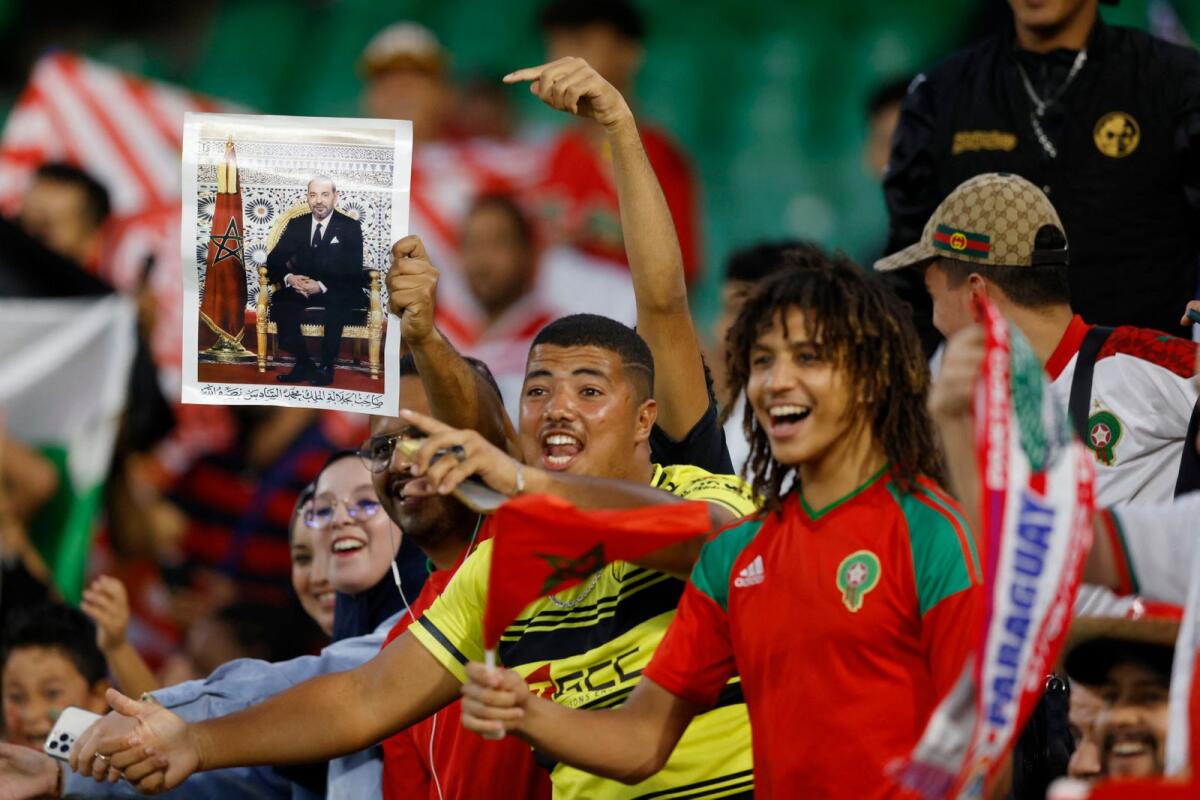 Morocco fans hold up a picture of the King of Morocco Mohammed VI at international friendy in September. Photo: Reuters