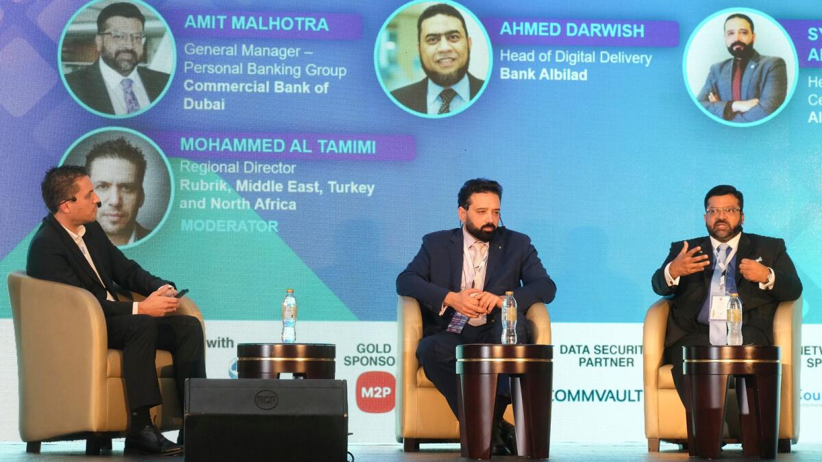 Mohammed Al Tamimi; Syed Mohammed Ali Naqvi, head of Data Center of Excellence, Al Hilal Bank; and Amit Malhotra, general manager – personal banking group, Commercial Bank of Dubai during the panel discussion on Technological trends at the Digibank on Tuesday. — Photo by Shihab