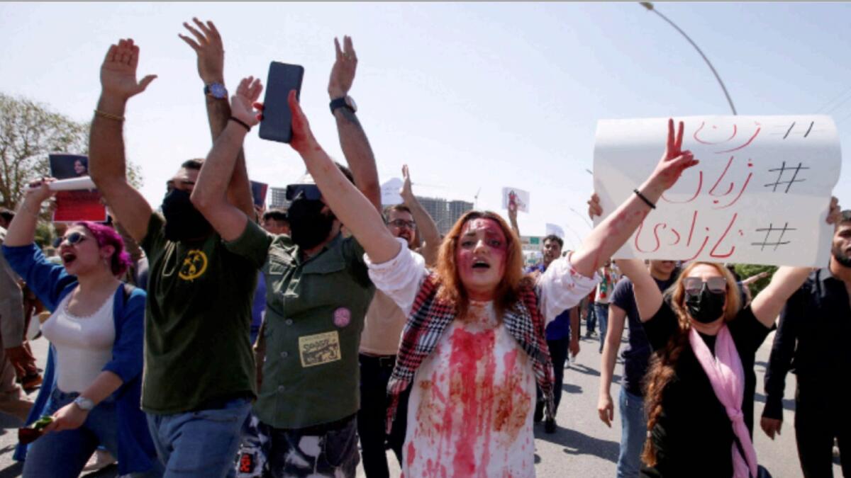 People take part in a protest following the death of Mahsa Amini in front of the United Nations headquarters in Erbil, Iraq. — Reuters