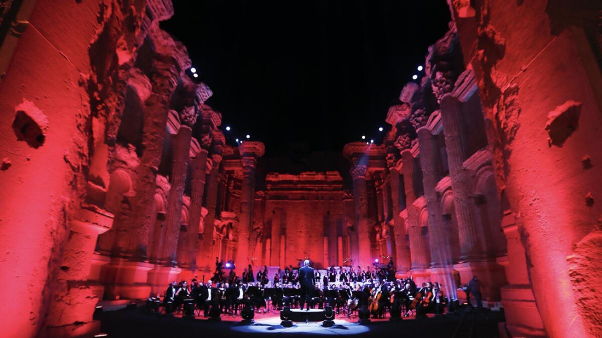 Musicians from the Lebanese Philharmonic Orchestra perform during a concert in the ancient northeastern city of Baalbek, Lebanon. Dubbed 'an act of cultural resilience,' the concert aims to send a message of unity and hope to the world amid the coronavirus pandemic and an unprecedented economic and financial crisis in Lebanon. For the first time since the Baalbek International Festival was launched in 1956, this year's concert is being held without an audience, in line with strict Covid-19 guidelines. Instead, it is being broadcast live on local and regional TV stations and live-streamed on social media platform.  - AP