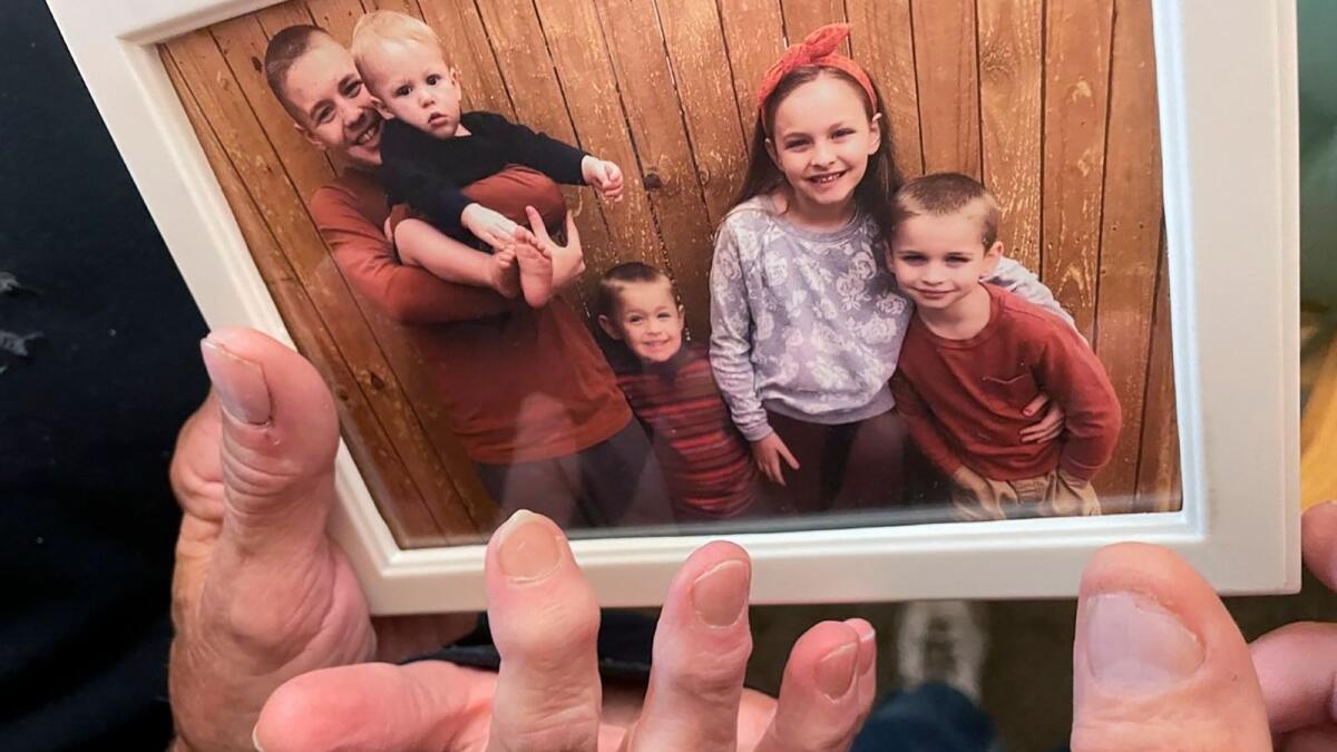 From left, Brian Anthony Nelson II, Kurgan Nelson, Ragnar Nelson, Brantley Nelson and Vegeta Nelson are seen in a framed photograph in their grandparents apartment in Tulsa, Oklahoma., on October 28, 2022. — AP fi