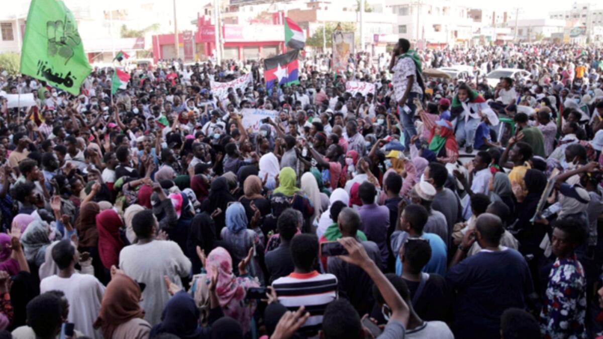 People chant slogans during a protest in Khartoum, Sudan. — AP