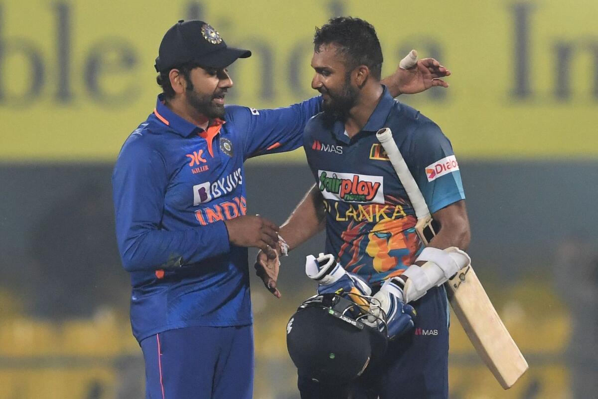India's captain Rohit Sharma (left) congratulates Sri Lanka's captain Dasun Shanaka on his century. — AFP