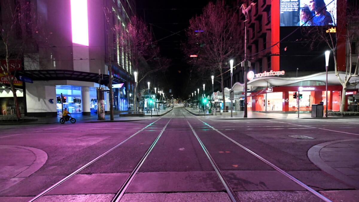 An empty Bourke Street is seen after a citywide curfew was introduced to slow the spread of the coronavirus disease in Melbourne, Australia. Photo: Reuters