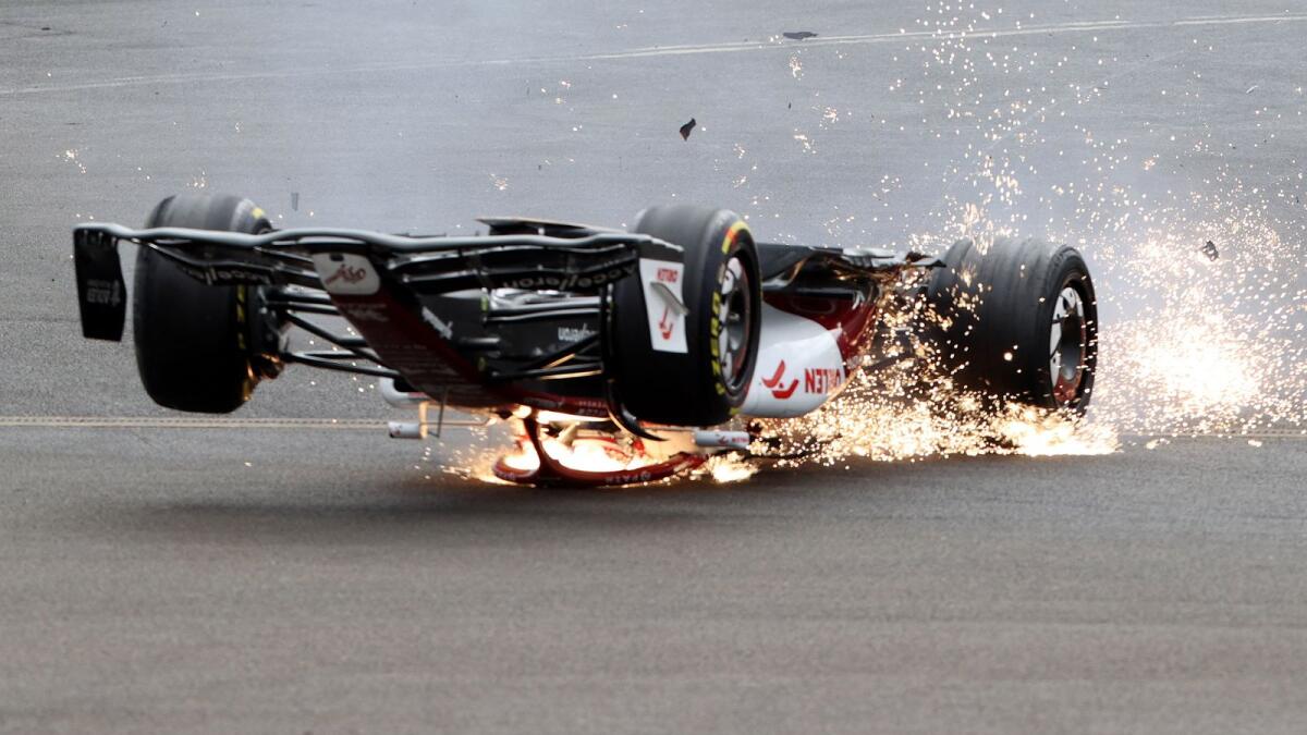 Alfa Romeo's Guanyu Zhou crashes out at the start of the race. Photo: Reuters