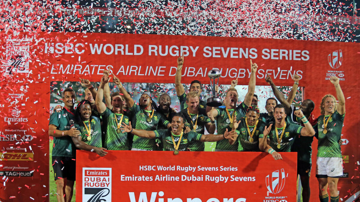 South African players celebrate after beating Fiji to claim the Emirates Airline Dubai Rugby Sevens Championship at the Sevens Stadium in Dubai on Saturday. — Photo by Dhes Handumon