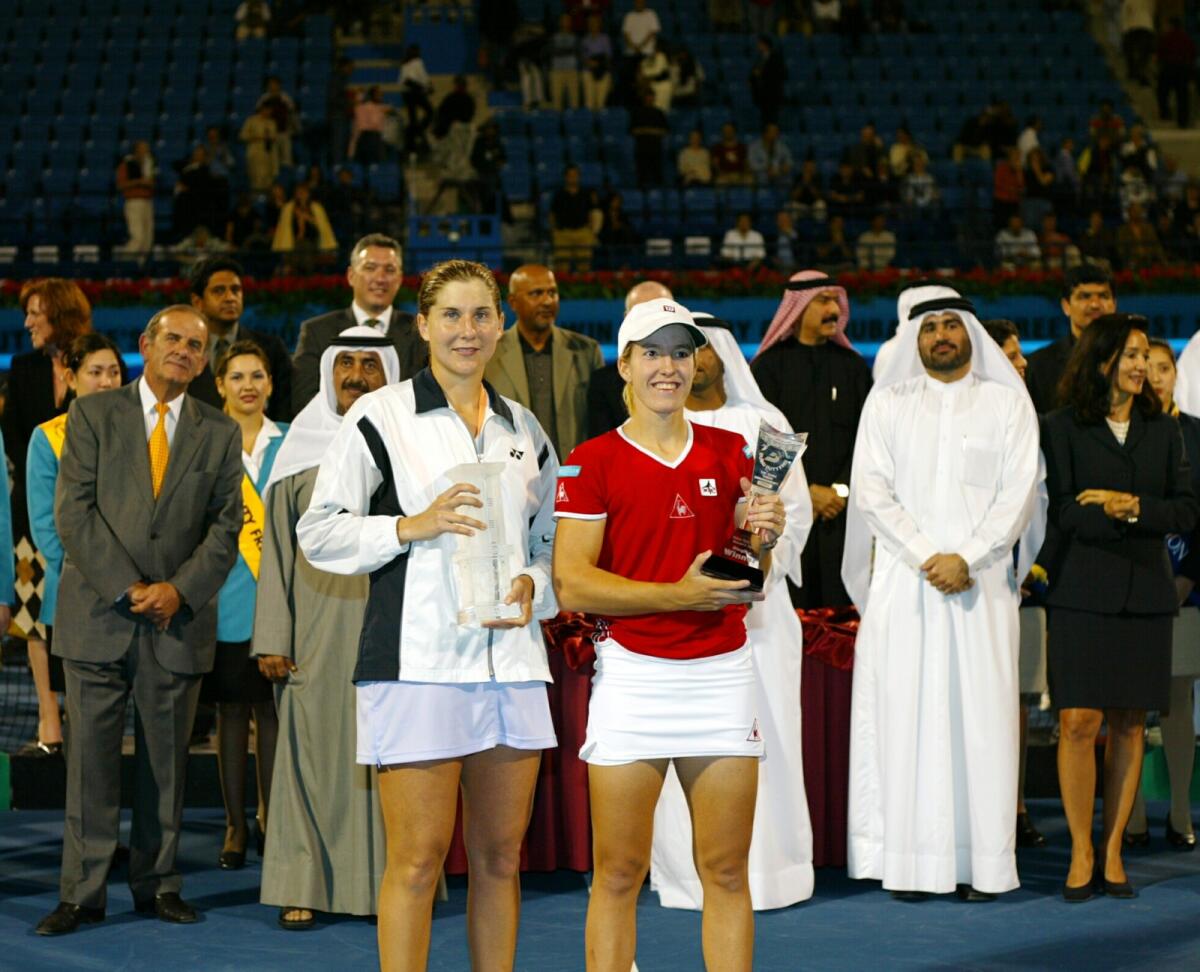 Justine Henin-Hardenne and Monica Seles with their trophies after the final in 2003. — Dubai Duty Free Tennis