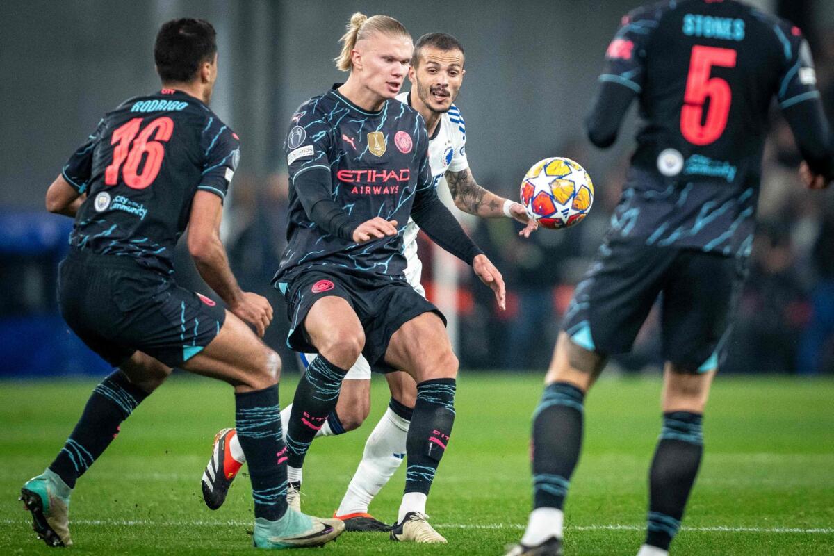 Manchester City's Norwegian striker Erling Haaland and FC Copenhagen's Portuguese forward Diogo Goncalves vie for the ball during the UEFA Champions League. - AFP