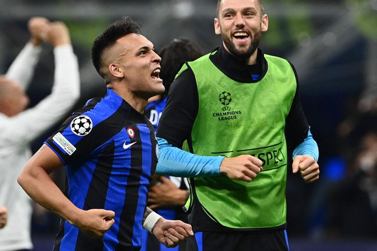 Inter Milan's Lautaro Martinez (left) celebrates at the end of the Champions League semifinal against AC Milan. — AFP