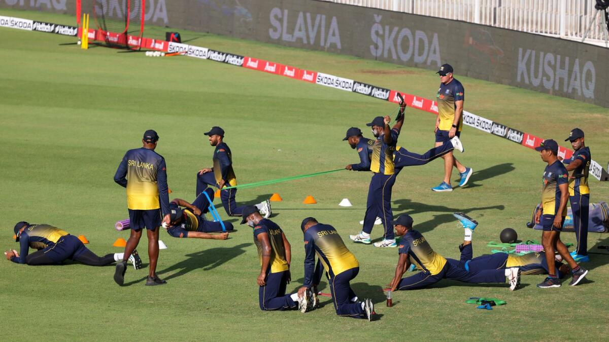 Sri Lankan players warm up before the start of the Asia Cup match against Afghanistan at the Sharjah Cricket Stadium. (AFP)