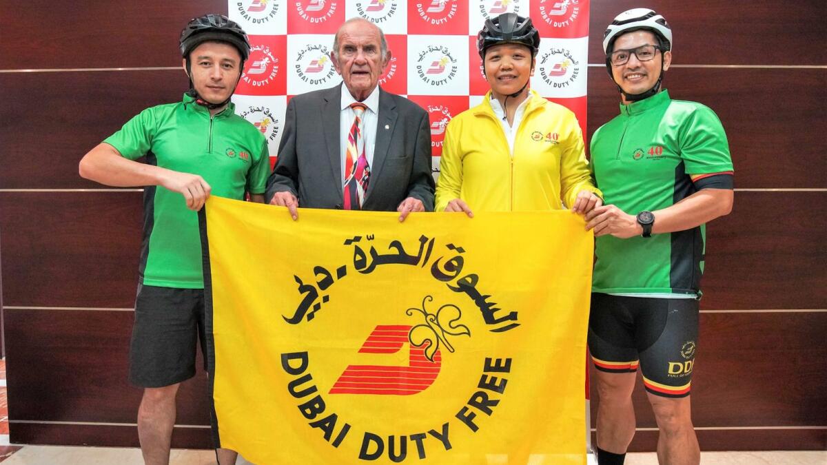 Dubai Duty Free Executive Vice Chairman &amp; CEO, Colm McLoughlin with the three Dubai Duty Free employees, Akram Ahmedov, Glenda Sagun and Nelvin Tesoro, who will participate in the cycling challenge in Namibia. - Supplied photo