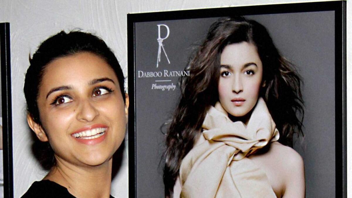 Mirror Mirror who is the prettier one? Parineeti Chopra poses in front of Alias calender picture