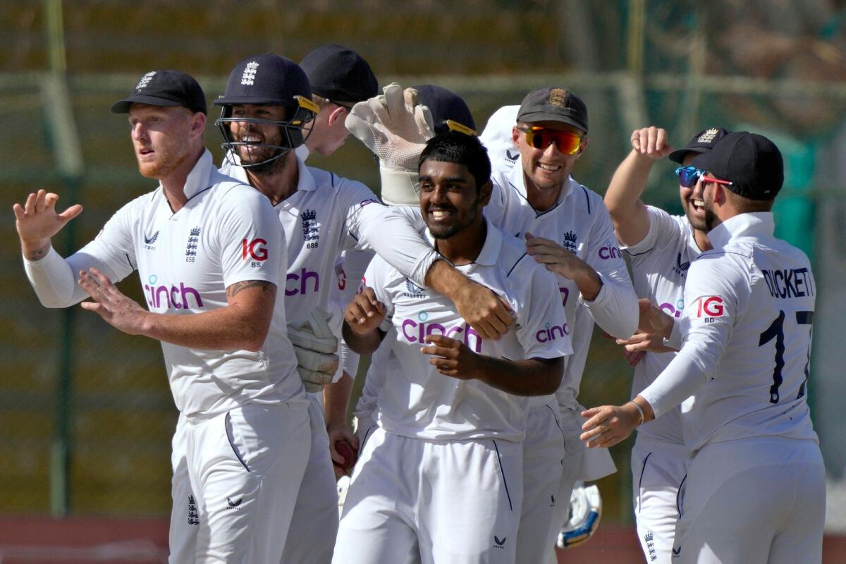 England's Rehan Ahmed (centre) celebrates with teammates after taking the wicket of Pakistan's Saud Shakeel. — AP