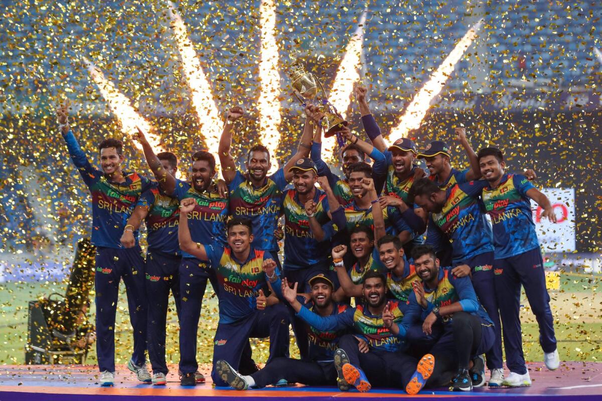 Sri Lanka's players celebrate with the trophy after their Asia Cup win. (AFP)