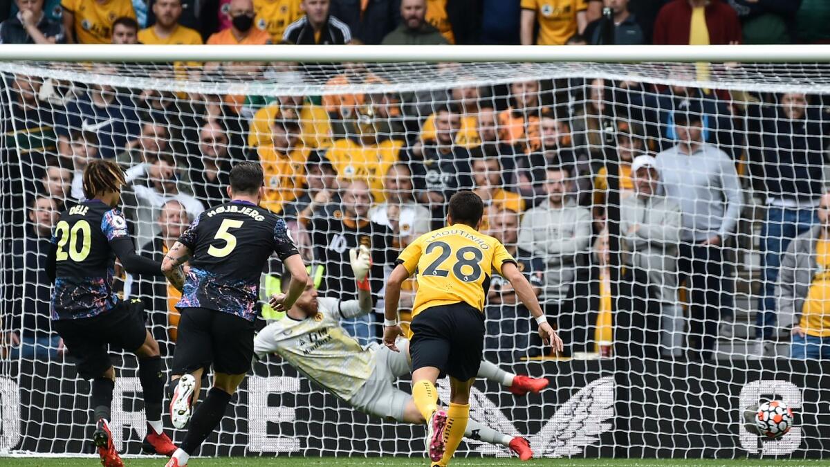 Tottenham’s Dele Alli (left) scores from spot during the English Premier League  match against Wolverhampton Wanderers. — AP