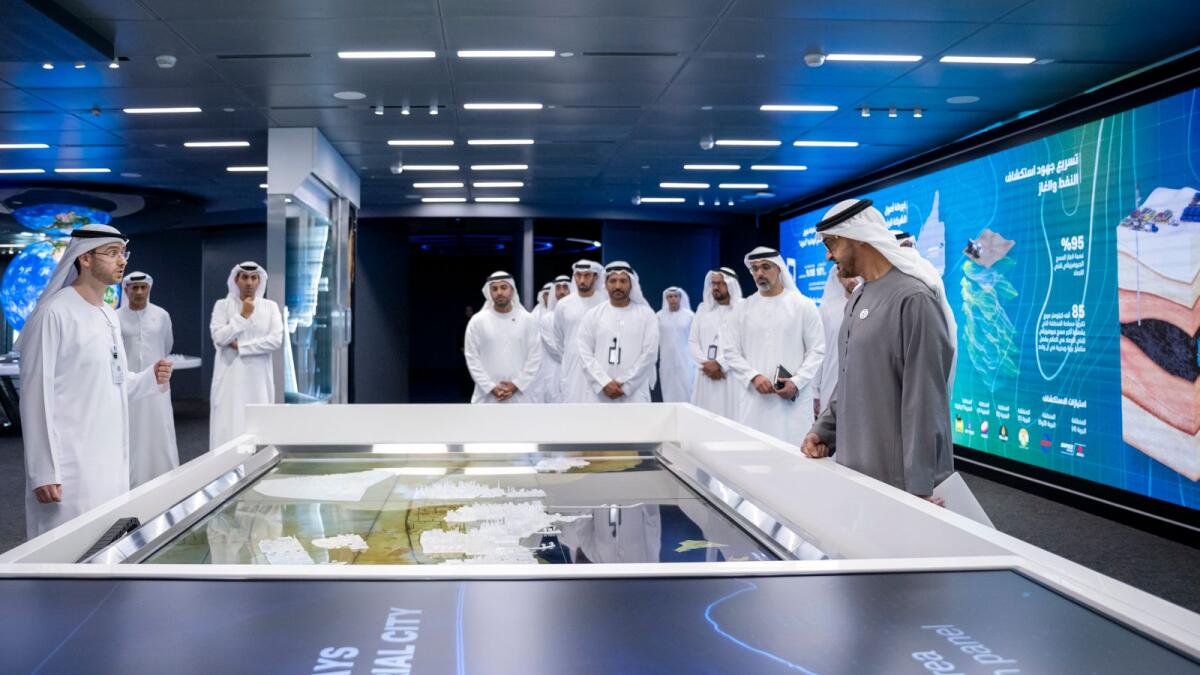 The Preisent, His Highness Sheikh Mohamed bin Zayed Al Nahyan tours Abu Dhabi National Oil Company (Adnoc) headquarters, after a Supreme Petroleum Council meeting. Seen with Sheikh Khaled bin Mohamed bin Zayed Al Nahyan, Member of Abu Dhabi Executive Council and Chairman of Abu Dhabi Executive Office. — Wam