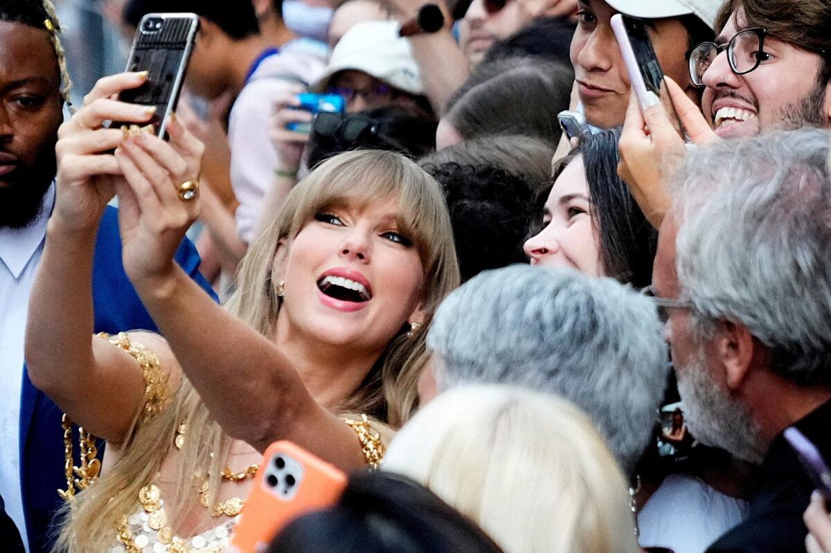 Singer Taylor Swift poses for a selfie with fans as she arrives to speak at the Toronto International Film Festival (TIFF) in Toronto, Ontario, Canada, on September 9, 2022. — Reuters file
