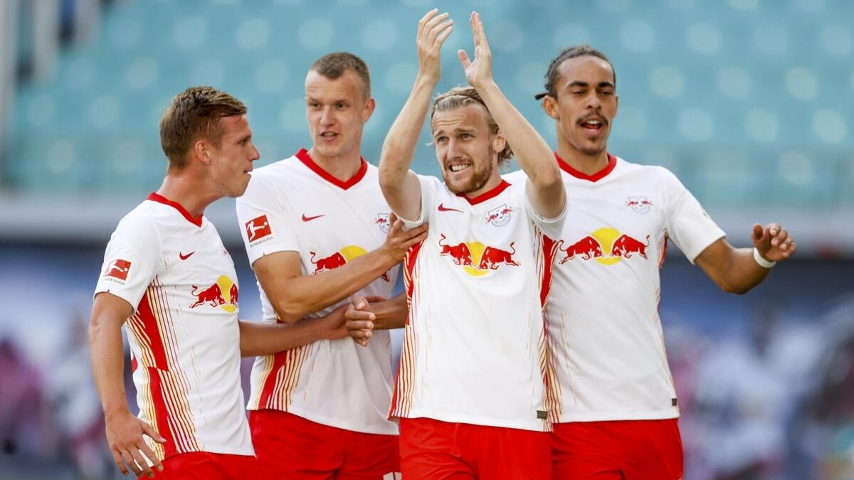 Leipzig's Emil Forsberg celebrates with teammates after scoring with a penalty during a German Bundesliga match against FSV Mainz 05