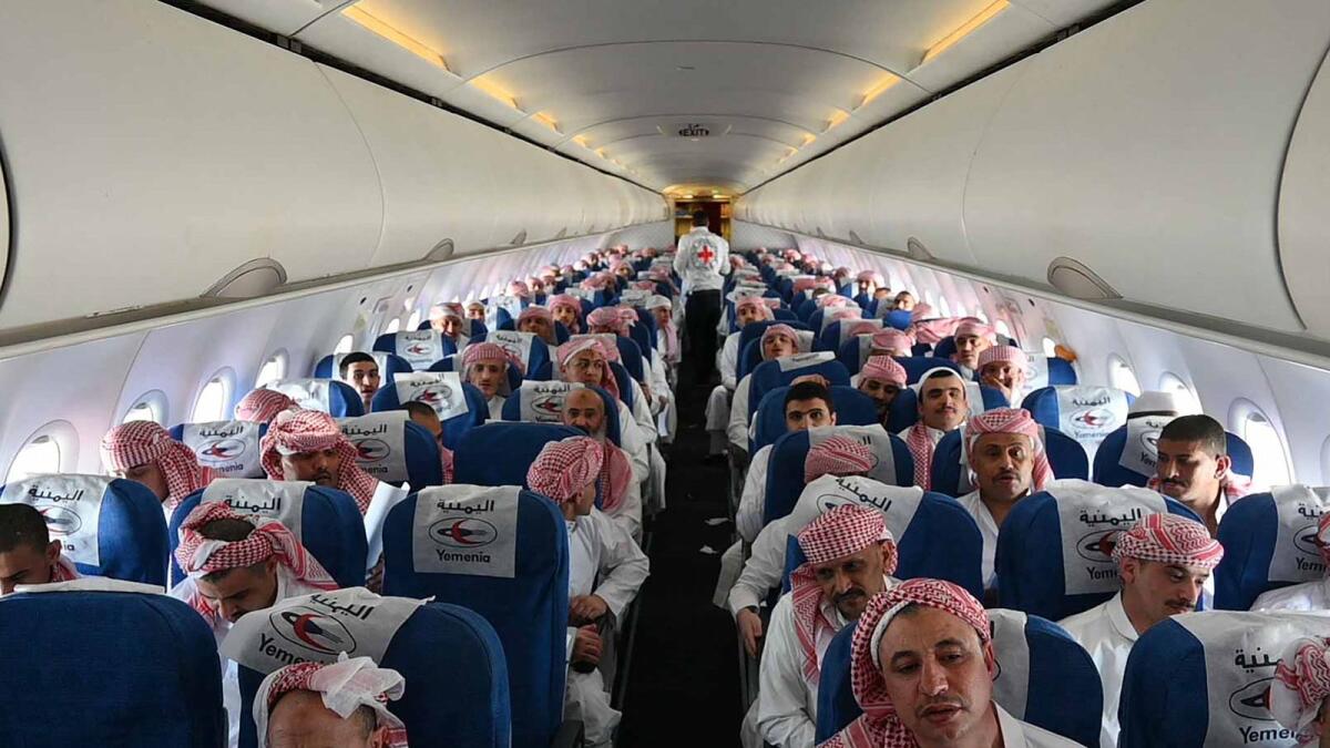 Freed Houthi prisoners awaiting take off on board a plane from the Saudi city of Abha to Yemen's capital Sanaa. — AFP