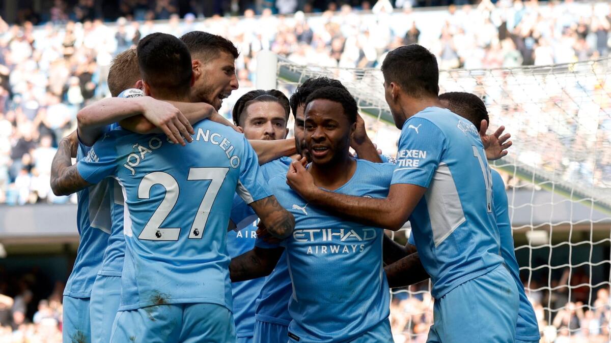 Manchester City's Raheem Sterling celebrates his goal with teammates. (Reuters)