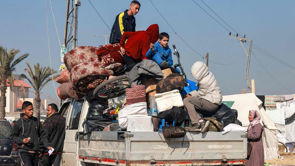 A truck carrying people fleeing from the central Gaza Strip with their belongings arrives in Rafah following an evacuation order on Tuesday. Photo: AFP