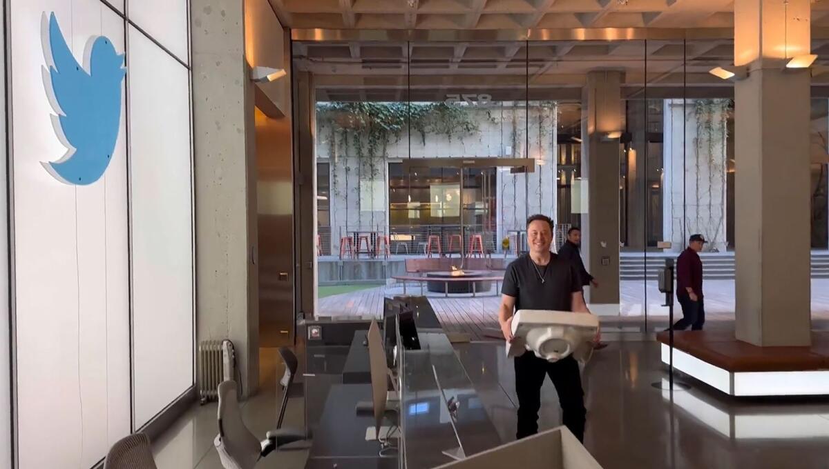 This screenshot of a video posted by Elon Musk on Wednesday shows him carrying a sink as he enters Twitter’s headquarters in San Francisco. Photo: AFP
