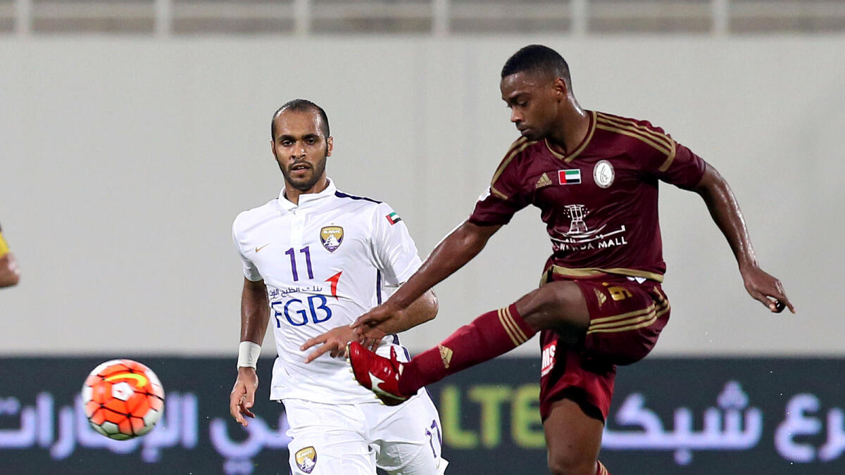 Al Wahdas AbdulAllah Al Nubi takes a shogt at goal as Al Ains Saeed Al Katheeri (looks on during their Arabian Gulf Cup match at Al Nahyan Stadium on Friday. 