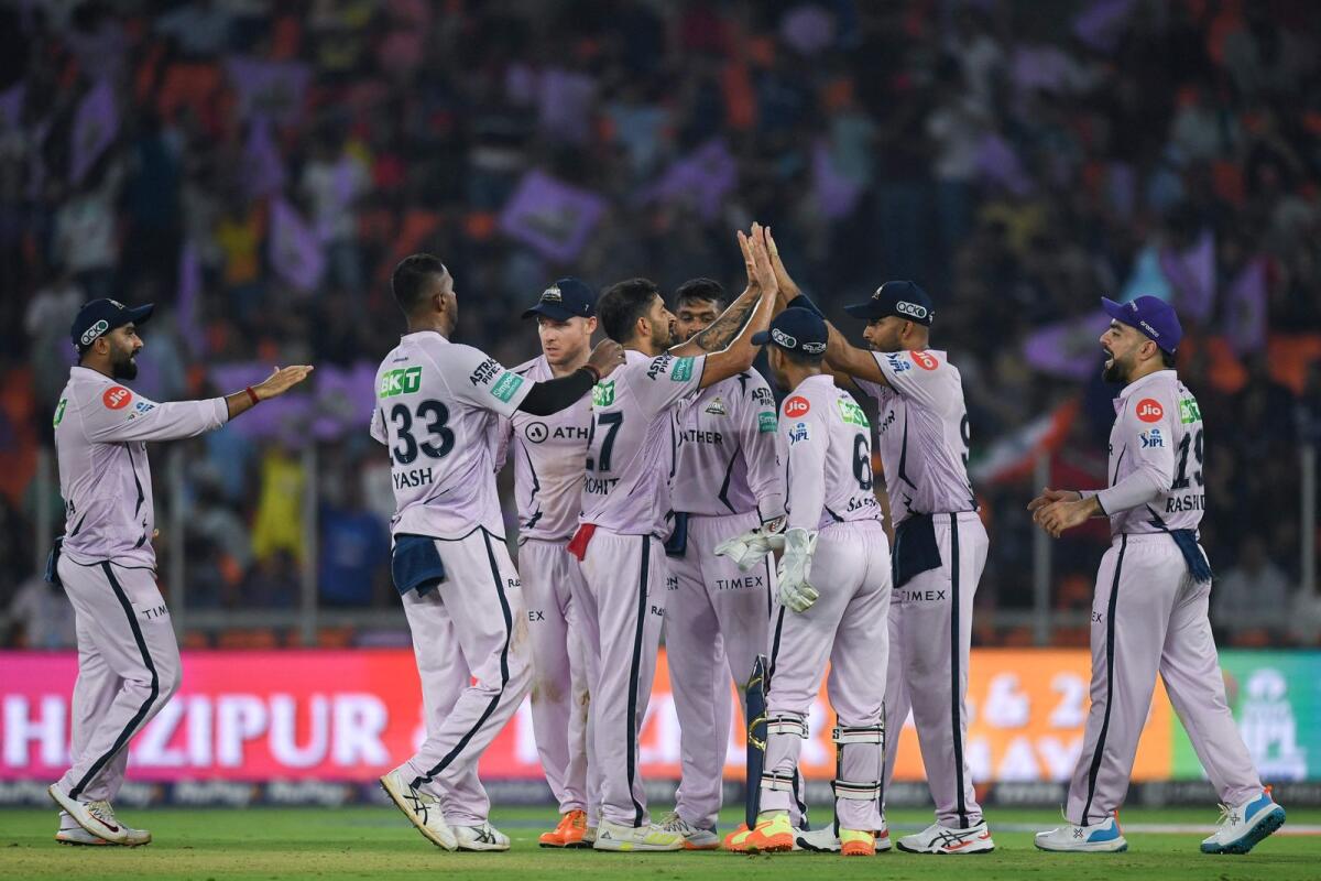 Gujarat Titans' players celebrate a wicket against Sunrisers Hyderabad at the Narendra Modi Stadium in Ahmedabad. — AFP