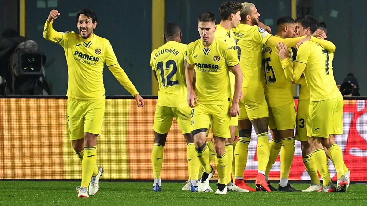Villarreal's Daniel Parejo (left) and teammates celebrate after they scored their third goal. (AFP)