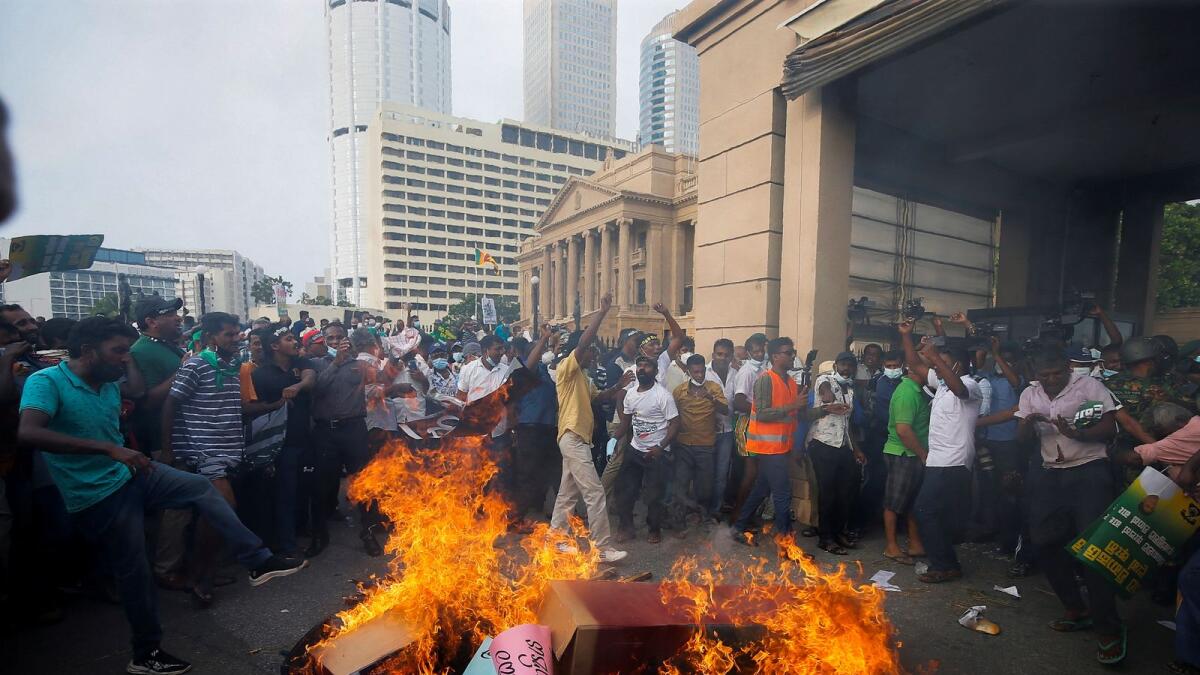 People block the main road in front of the President's secretariat during a protest organised by main opposition party Samagi Jana Balawegaya against the worsening economic crisis. – Reuters