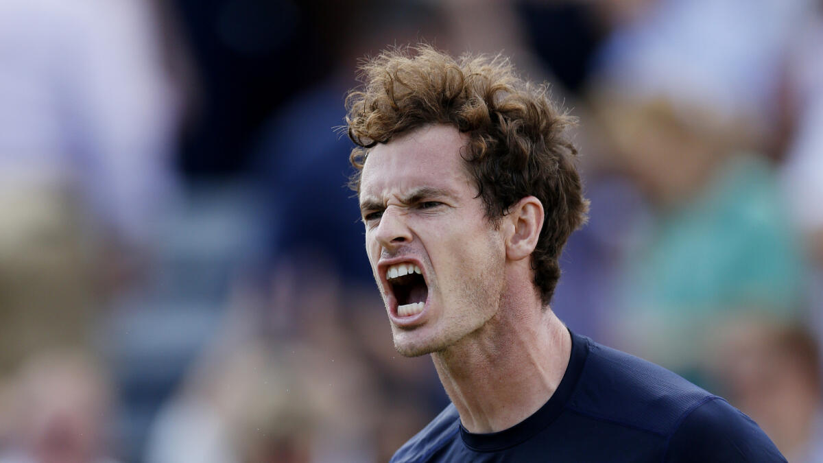Britain's Andy Murray celebrates after winning the second set of his match.