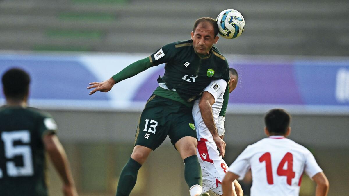 Pakistan’s player heads the ball during agsinst Tajikistan. — AFP file photo