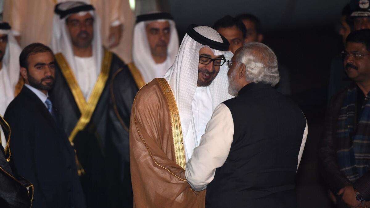 Indian Prime Minister Narendra Modi greets His Highness Shaikh Mohammed bin Zayed Al Nahyan, Crown Prince of Abu Dhabi and Deputy Supreme Commander of the UAE Armed Forces, after the prince arrived at an air force base in New Delhi on February 10, 2016.