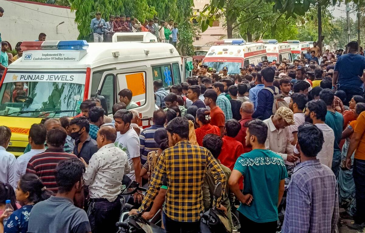 Ambulances arrive at the temple after the roof of an ancient well situated in a temple collapsed during Ram Navmi celebrations in Indore on Thursday. — PTI