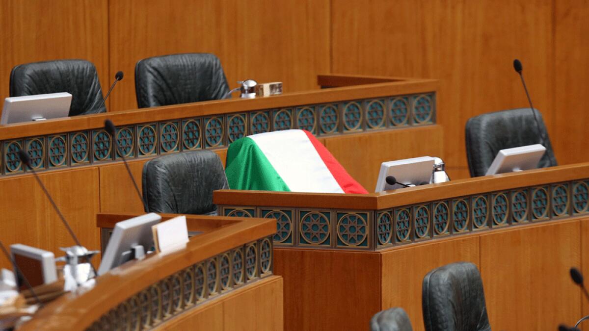 The Kuwaiti flag is seen placed at the seat of MP Nabeel Al Fadhl at the national assembly in Kuwait City.