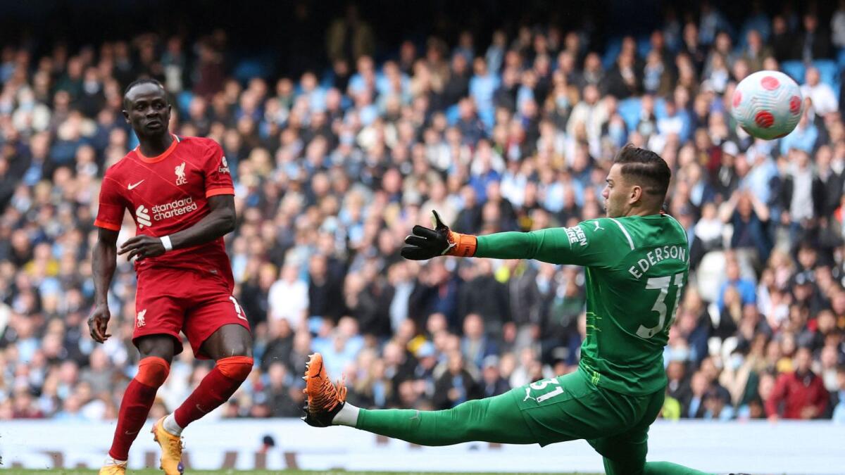 Liverpool's Sadio Mane scores their second goal against Manchester City. (Reuters)