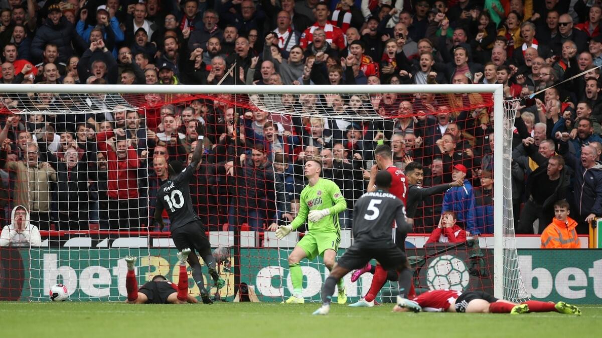 Liverpool extend lead with hard-fought win at Sheffield United