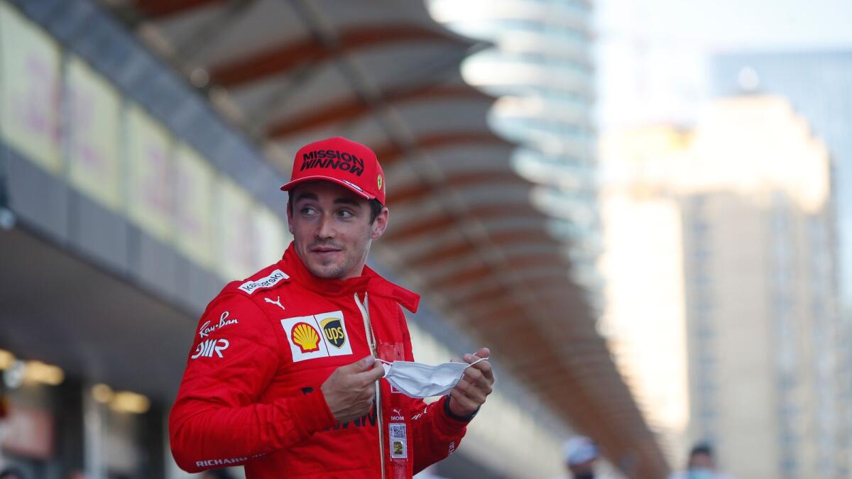 Ferrari driver Charles Leclerc of Monaco smiles after taking pole position. — AP