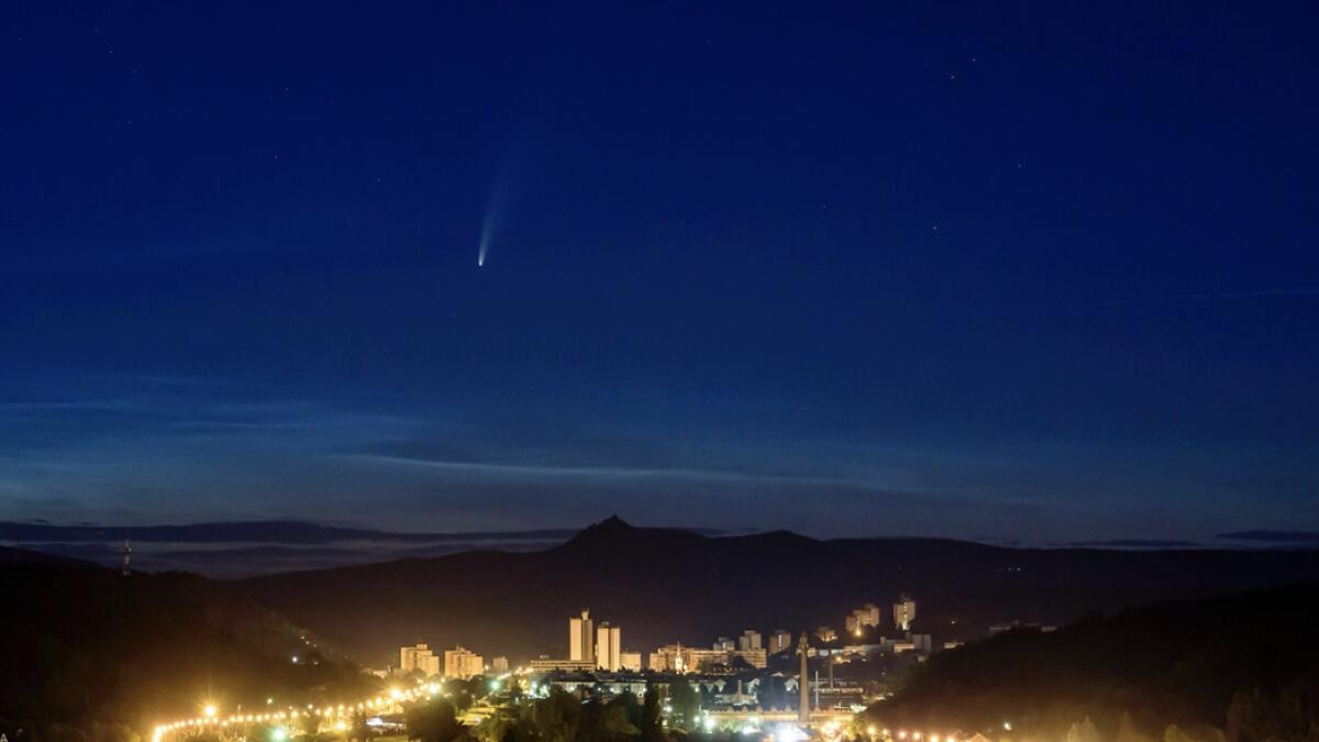 The Comet NEOWISE or C/2020 F3 is seen above Salgotarjan, Hungary, early Friday, July 10, 2020. It passed closest to the Sun on July 3 and its closest approach to Earth will occur on July 23. Photo: AP